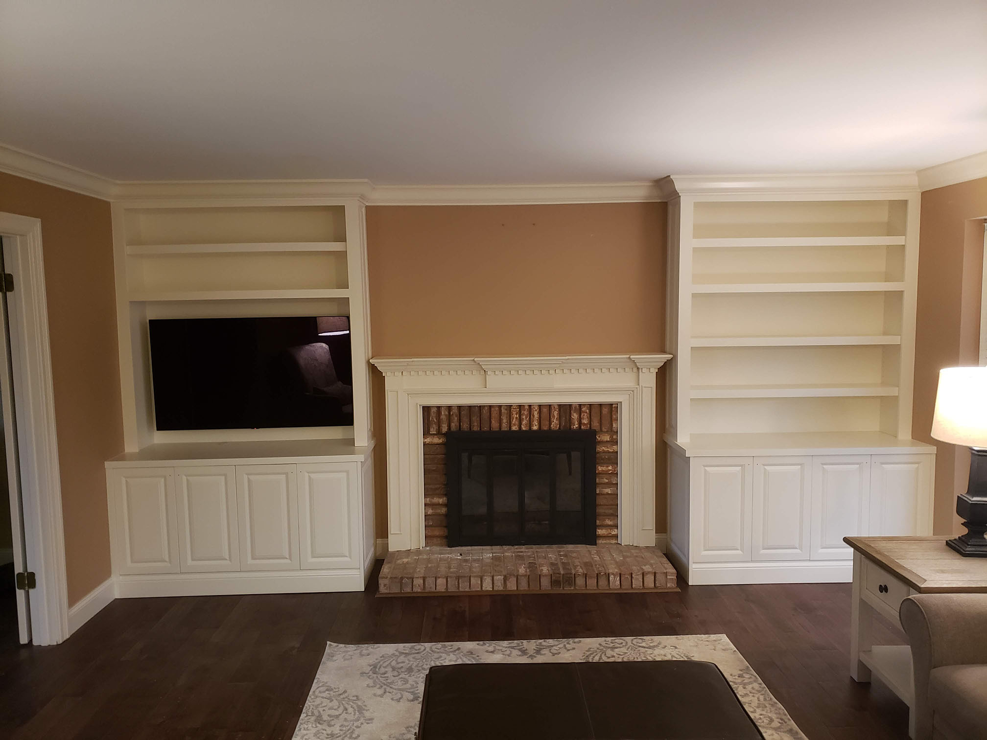 Entertainment center with custom shelving and cabinets - Professional Wood Interiors